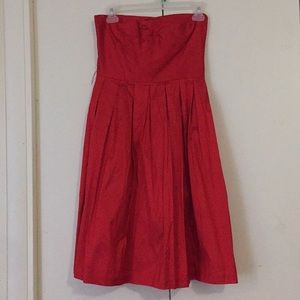 Red strapless dress.